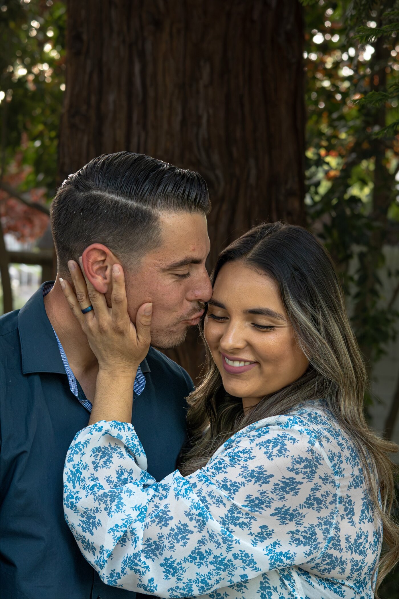 Couple sharing a forehead kiss