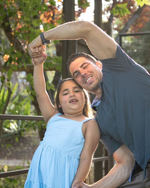 Father and daughter posing playfully