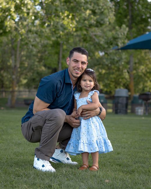 Father hugging his youngest daughter
