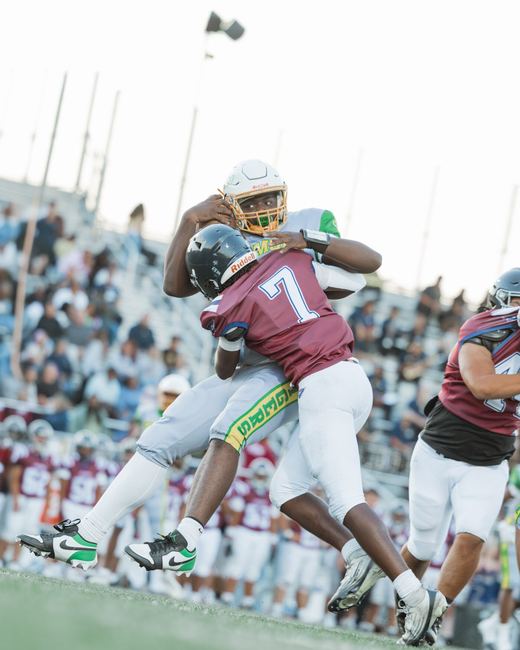 Defender wrapping up a ball carrier