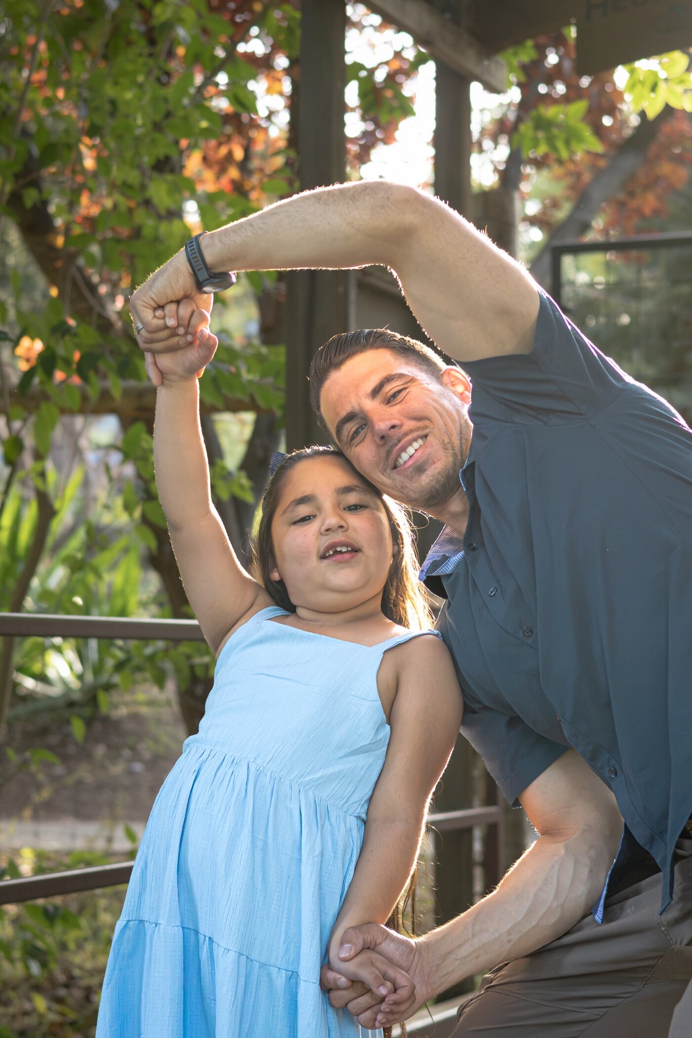 Father and daughter posing playfully