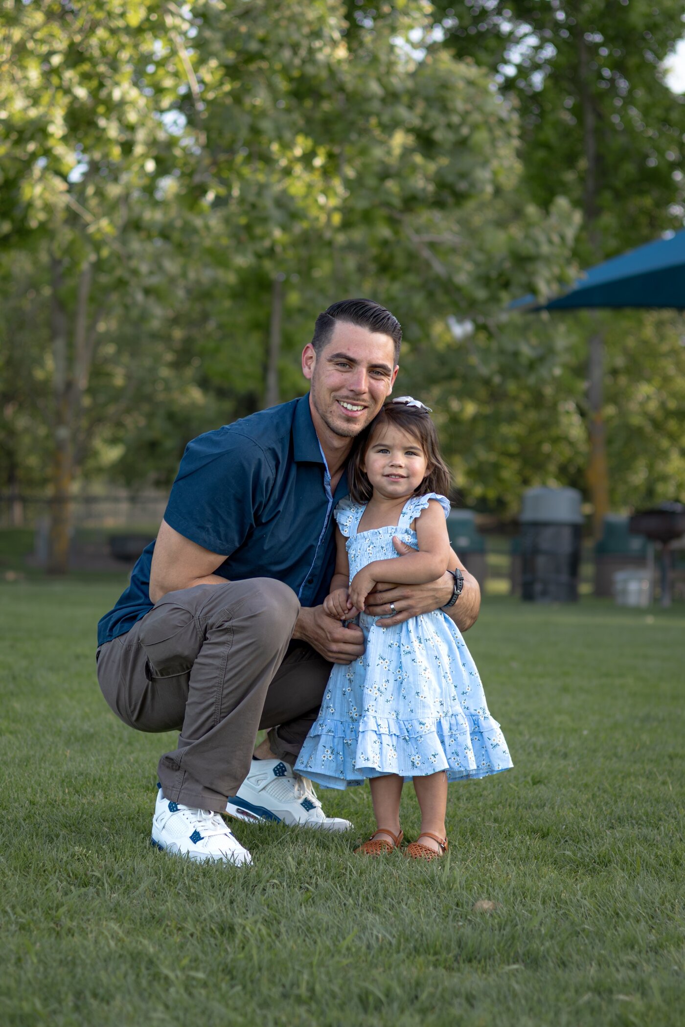 Father hugging his youngest daughter