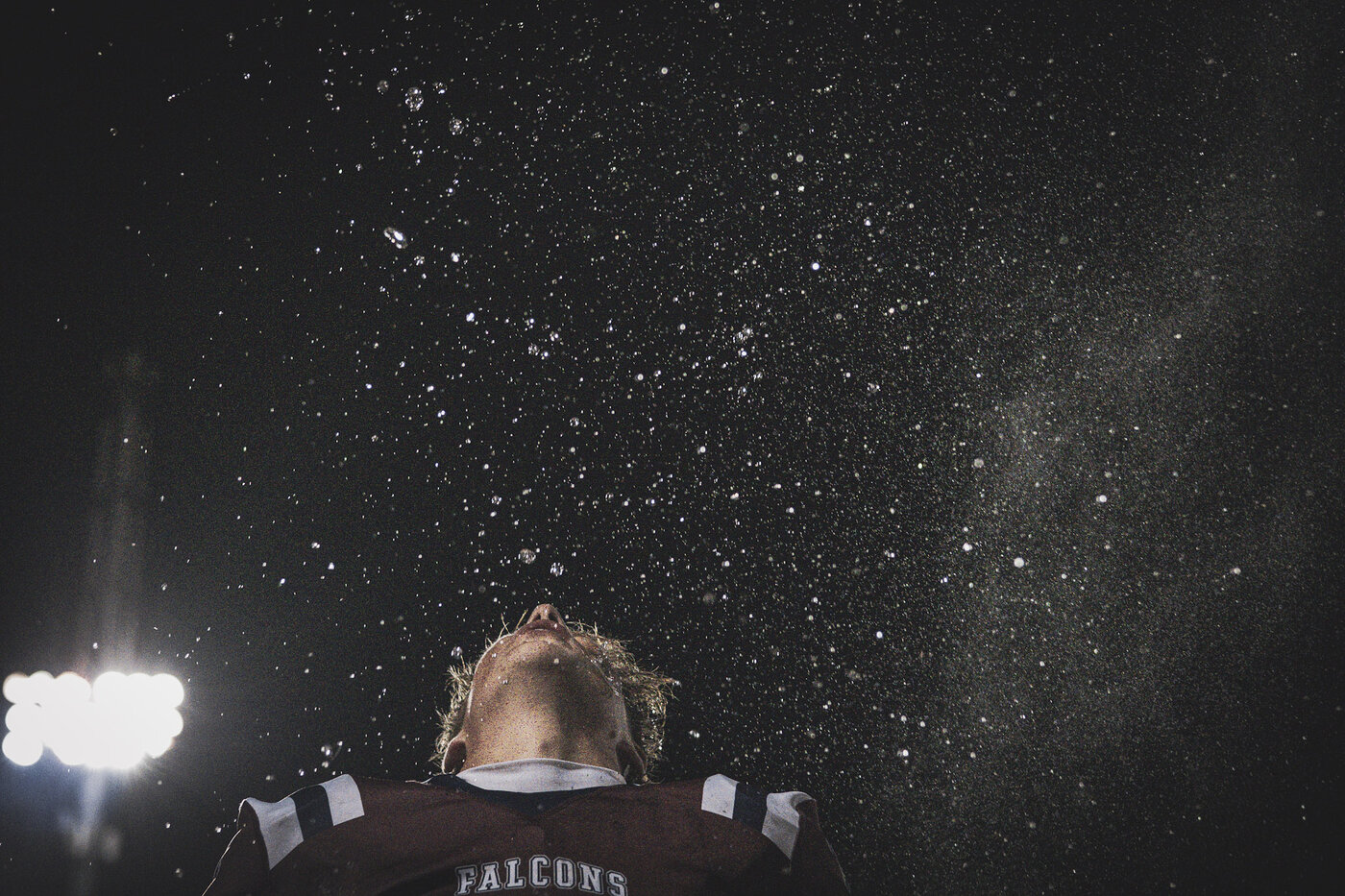 Player looking up under the lights at a night game