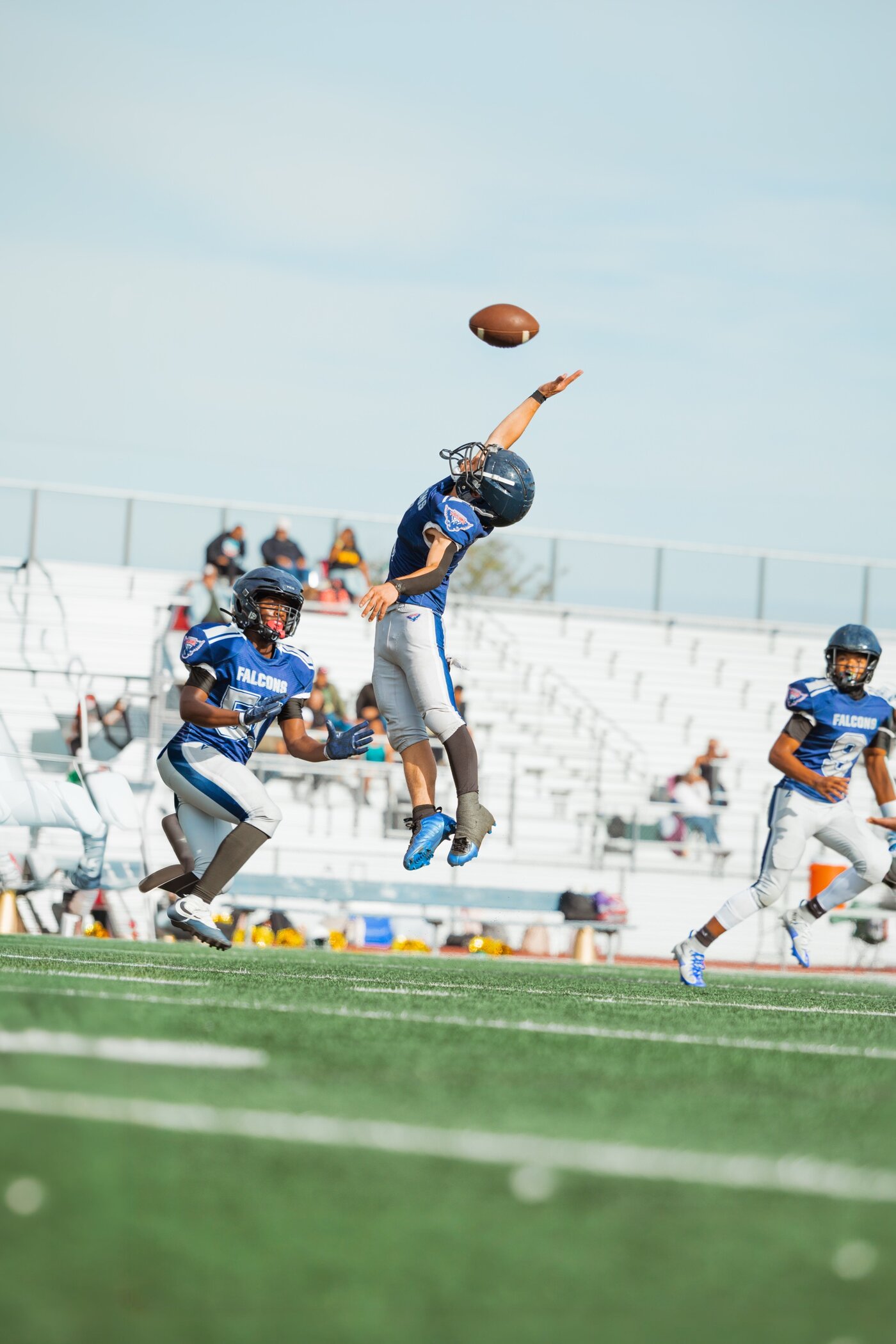 Player reaching up for a pass