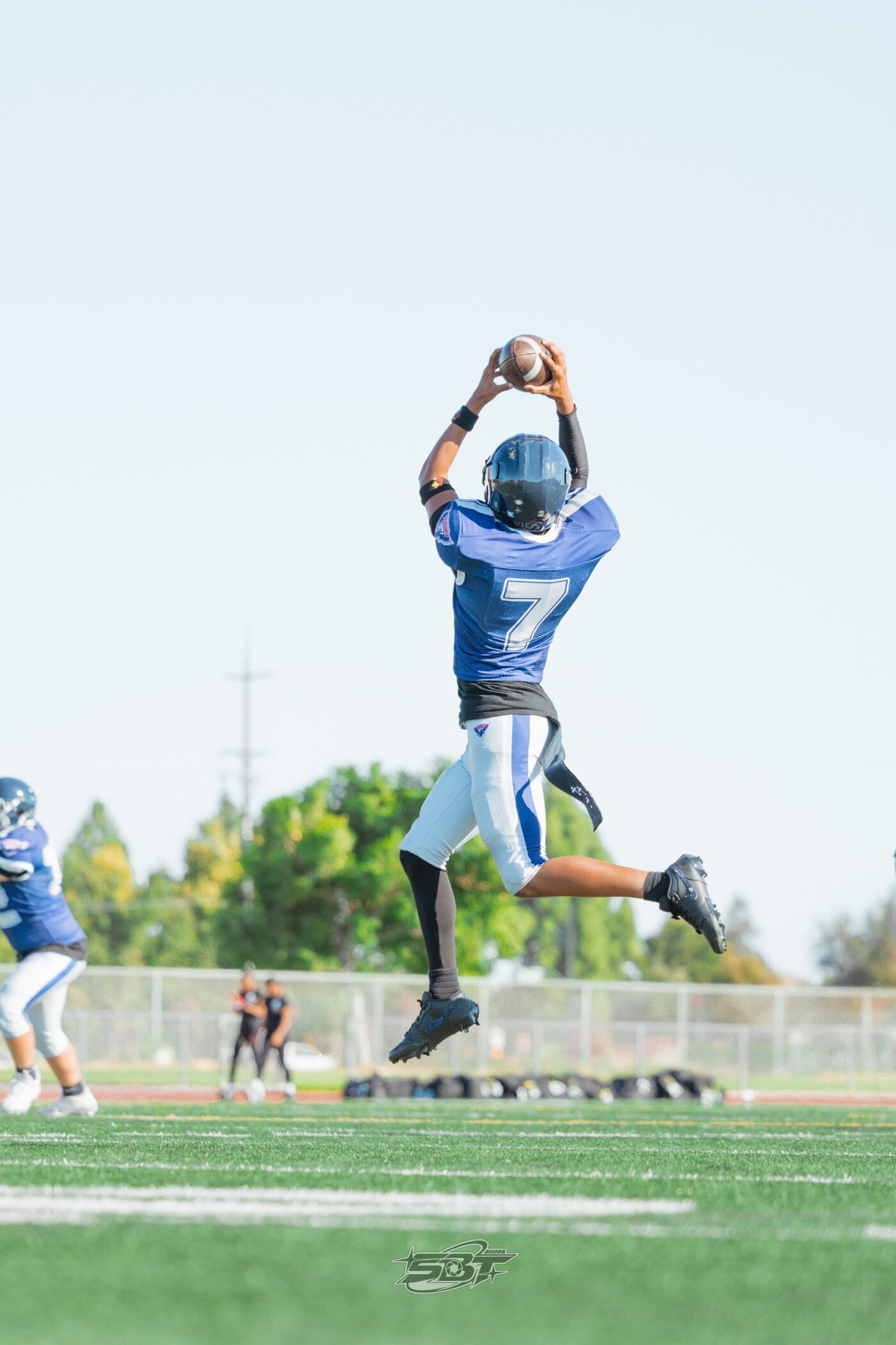 Player jumping for a high catch