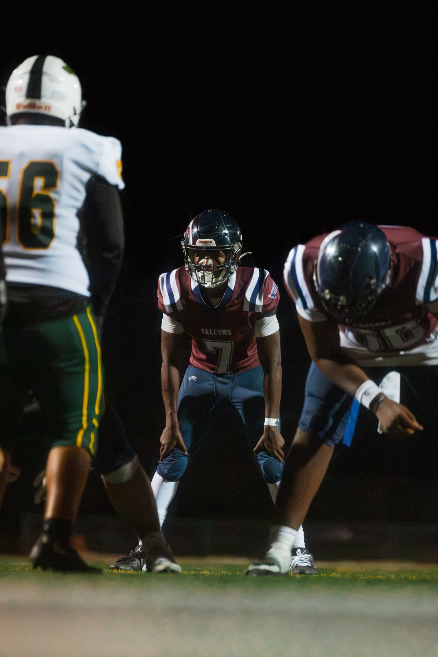 Quarterback under the lights before the snap