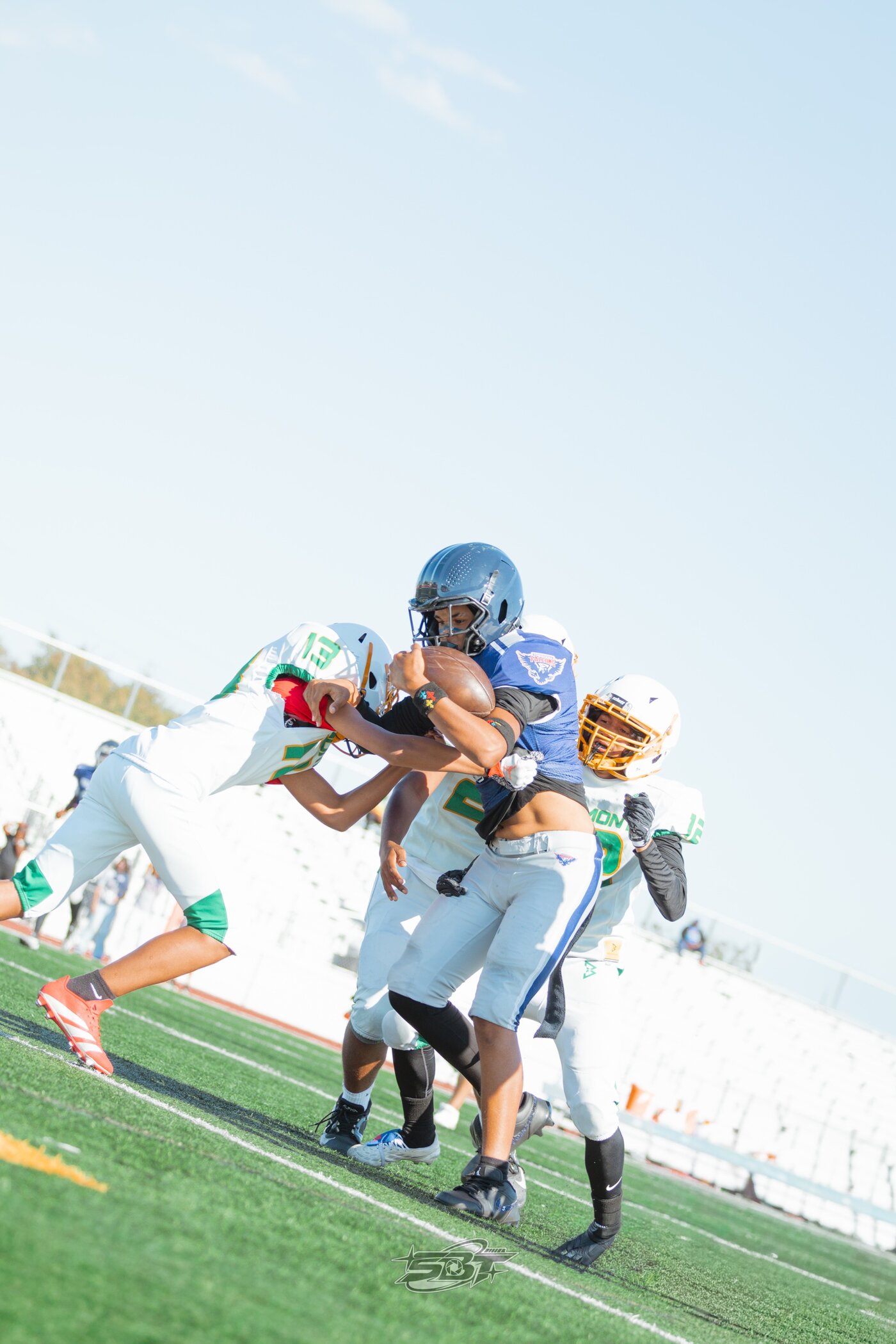 Defender making a tackle in daylight