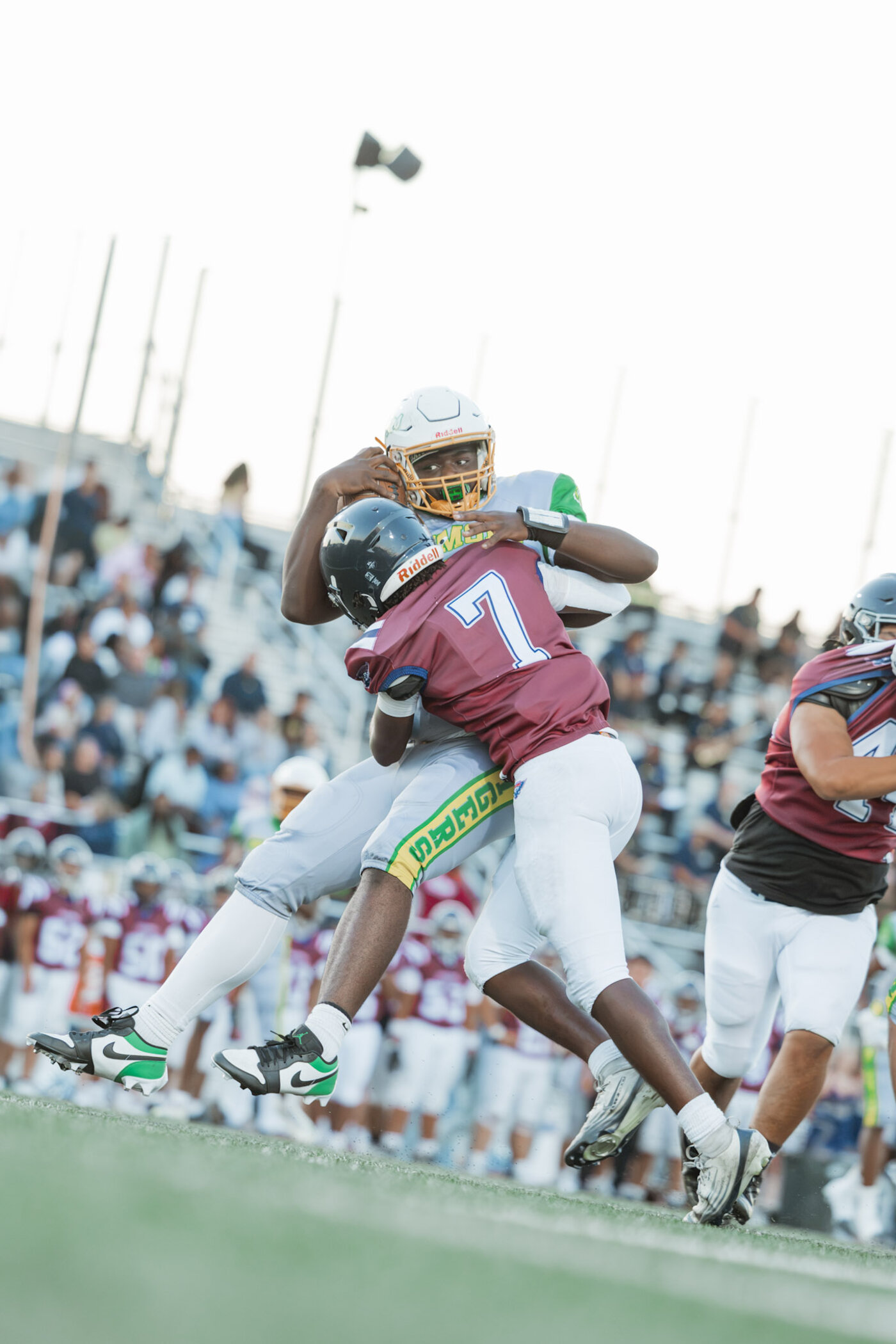 Defender wrapping up a ball carrier