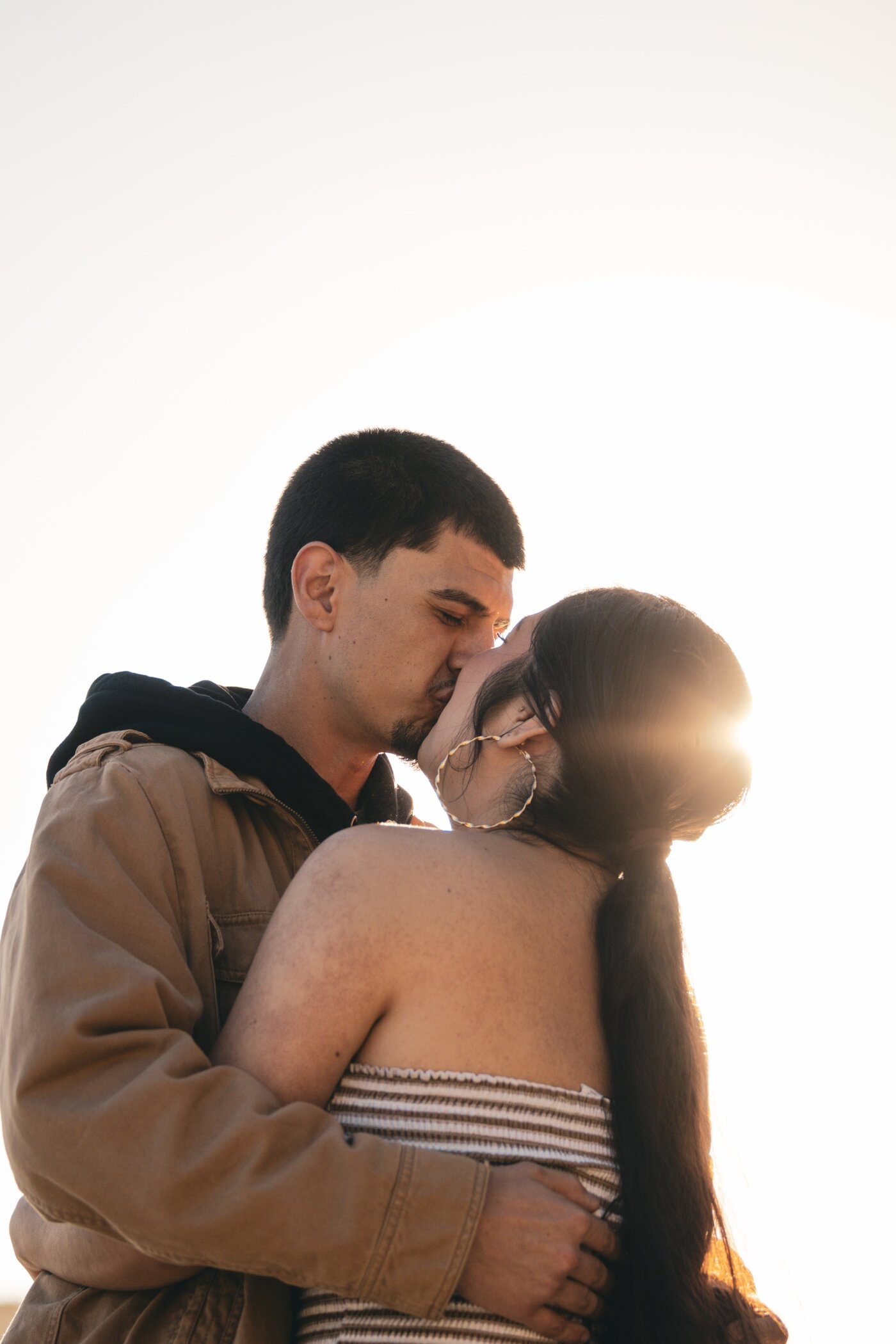 Couple kissing on the beach